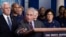 Dr. Anthony Fauci, director of the National Institute of Allergy and Infectious Diseases, with Vice President Mike Pence behind him, speaks during a briefing about the coronavirus in the James Brady Press Briefing Room of the White House, March 15, 2020, 