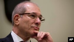 FILE - OPCW Director-General Ahmet Uzumcu attends press conference, Rome, Jan. 16, 2014.