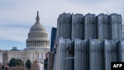 Security fencing is stacked near the US Capitol building on the National Mall ahead of the January 6th certification of the 2024 Presidential Election in Congress in Washington, DC, on Jan. 5, 2025. 
