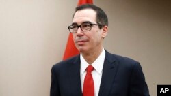 Treasury Secretary Steven Mnuchin arrives for a meeting, April 21, 2017, at the 2017 World Bank Group Spring Meetings in Washington. 