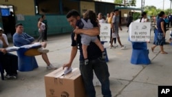A man votes in Guayaquil, Ecuador, Aug. 20, 2023. The special election was called after President Guillermo Lasso dissolved the National Assembly by decree in May to avoid being impeached. 