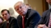 FILE - President Donald Trump listens during a meeting with steel and aluminum executives in the Cabinet Room of the White House in Washington, March 1, 2018.