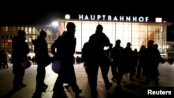 German riot police officers take their possitions near the Hauptbahnhof before New Year celebrations for 2017 in Cologne, Germany, Dec. 31, 2016. 