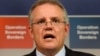 FILE - Australian Immigration Minister Scott Morrison speaks during a press conference in Sydney.