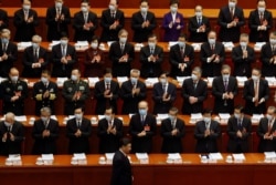 Chinese President Xi Jinping arrives for the opening session of the National People's Congress at the Great Hall of the People in Beijing, China, March 5, 2021.