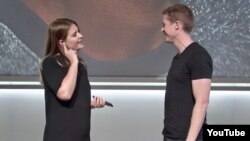 Google's Isabelle Olsson and Juston Payne introduce the language translation feature of the Pixel Buds headphones during a launch event at the SFJAZZ Center in San Francisco, Wednesday, Oct. 4, 2017. (AP Photo/Jeff Chiu) 