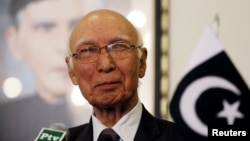 FILE - Pakistani national security adviser Sartaj Aziz, pictured at a news conference in April, says his country is sharing information with Afghanistan to try to prevent the Taliban from using Pakistan's side of the porous frontier. 