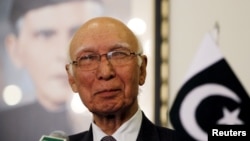 FILE - Adviser to Pakistan's Prime Minister on National Security and Foreign Affairs Sartaj Aziz listens to a question during a news conference with Iranian Foreign Minister Javad Zarif at the Foreign Ministry in Islamabad, April 8, 2015. 
