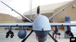 FILE - A U.S. MQ-9 drone is on display during an air show at Kandahar Airfield, Afghanistan, Jan. 23, 2018.