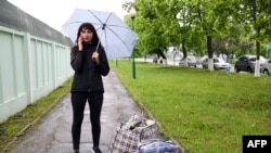 Katerina Borisevich, a journalist for the independent Tut.by news website, speaks on a mobile phone after being released from prison in the town of Gomel, some 310kms south-east of Minsk on May 19, 2021. 