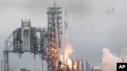 In this image from NASA TV, the SpaceX Falcon rocket launches from the Kennedy Space Center in Florida, Feb. 19, 2017. 