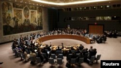 The United Nations Security Council votes to approve a resolution at the U.N. headquarters in New York, July 20, 2015.