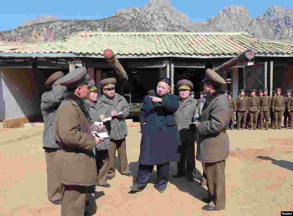 North Korean leader Kim Jong Un visits a long-range artillery sub-unit of the Korean People&#39;s Army Unit 641, March 11, 2013. (KCNA) 