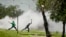 Protesters caught in teargas, hurl stones at police, unseen, during violent clashes in Sasolburg, South Africa, January 22 2013.