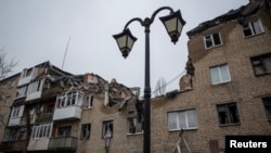 A view shows a residential building damaged by a Russian military strike, amid Russia's attack on Ukraine, in Bakhmut, Ukraine Dec. 18, 2022. 