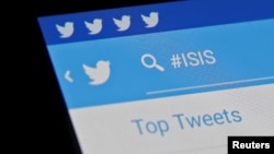 FILE - The Islamic State hashtag (#ISIS) is seen typed into the Twitter application on a smartphone in this picture illustration taken in Zenica, Bosnia and Herzegovina.