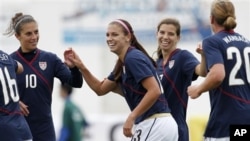 US players Carli Lloyd, Alex Morgan, Tobin Heath and Abby Wambach, from left, react after Morgan scored her second goal against Finland during their women's soccer Algarve Cup match, March 7 2011, in Quarteira, Portugal.