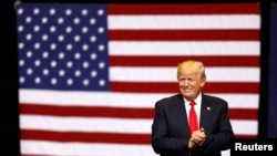 FILE - U.S. President Donald Trump takes the stage for a rally at the U.S. Cellular Center in Cedar Rapids, Iowa, U.S. 