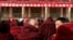 About 90 monks sit in front of a red banner that says: "Work Meeting for the Second Phase of Xicang Monastery's Rule of Law Propaganda Education Campaign," ahead of the re-education study session at the 200 year old Xicang Monastery in Luqu, China, Nov. 23, 2008.