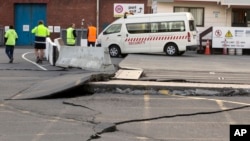A paved road is lifted at the ports in Wellington, New Zealand, Nov. 14, 2016, following an earthquake.
