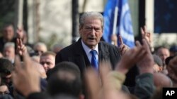 FILE - Sali Berisha, leader of the opposition Democratic Party, speaks to his supporters on Dec. 21, 2023. An Albanian court ordered Berisha's house arrest on Dec. 30.