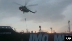 This image grab taken from a video provided by Iran's Revolutionary Guard official website via SEPAH News on July 20, 2019, allegedly shows Revolutionary Guard Corps boarding the British-flagged tanker Stena Impero in the Strait of Hormuz.