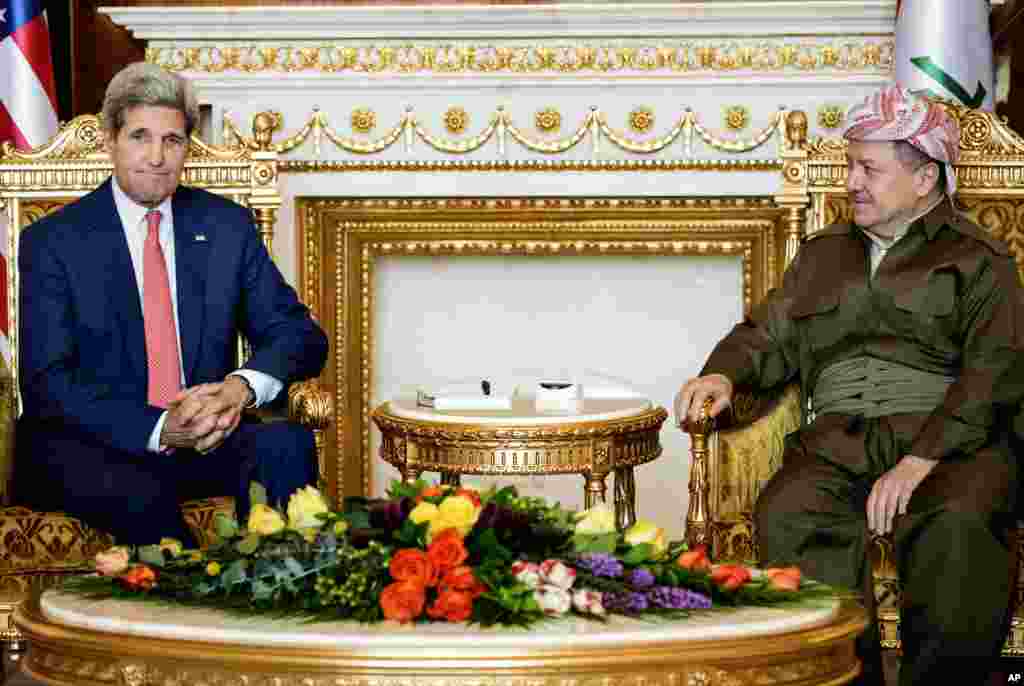 Kurdish regional President Massoud Barzani listens to U.S. Secretary of State John Kerry during a meeting at the presidential palace in Irbil, Iraq, June 24, 2014. 