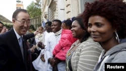 United Nations Secretary-General Ban Ki-moon (L) is greeted as he meets refugees and asylum-seekers during his visit to the Saint Egidio shelter in Rome, Oct. 17, 2015.