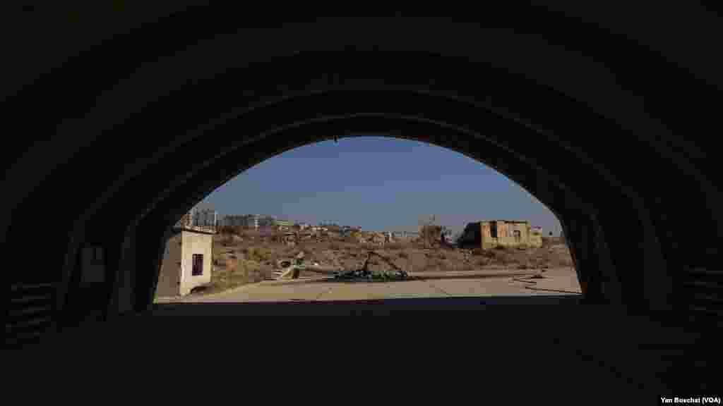 The remains of a helicopter destroyed by an Israeli air strike outside a protected area in the Mazzeh air base, in Damascus, on Dec. 19, 2024. (Yan Boechat/VOA)