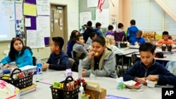 FILE - Students are served breakfast at the Stanley Mosk Elementary School in Los Angeles, April 8, 2015. (AP Photo/Nick Ut)