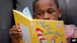 Michael Crowder, 11, reads during an after-school literacy program in Atlanta on Thursday, April 6, 2023. (AP Photo/Alex Slitz)