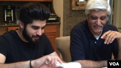 Danish Bashir eats dinner with his father, Imran, at their home in Springfield, Virginia. (C. Presutti/VOA)
