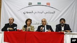 From left: Ahmed Ramadan, Bassma Kodmani, Abdulbaset Seida and Imad Aldeen Rashid speak as a group of Syrian opposition members announce a Syrian National Council in Istanbul, Turkey, September 15, 2011.