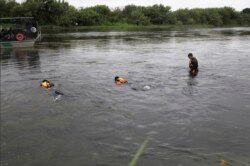 A U.S. Border Patrol Del Rio Sector Dive Team searches for a 2-year-old Haitian girl in Rio Grande River in Del Rio, Texas, July 2, 2019.
