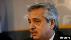 FILE - Argentina’s President-elect Alberto Fernandez speaks during a news conference after a meeting with Uruguay's President Tabare Vazquez at the Presidential House in Montevideo, Uruguay, Nov. 14, 2019. 