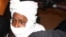 FILE - Security personnel surround former Chadian dictator Hissene Habre inside a courtroom in Dakar, Senegal, July 20, 2015.