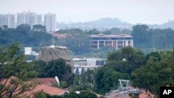 Part of the facade of Capella Hotel is seen in the center of the photo, on Sentosa Island in Singapore, June 6, 2018, ahead of a planned summit Tuesday, June 12, in Singapore between President Donald Trump and North Korean autocrat Kim Jong Un.