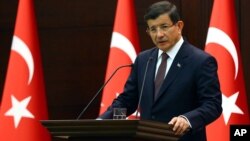 FILE - Turkish Prime Minister Ahmet Davutoglu speaks in Ankara, Turkey, Sept. 7, 2015.