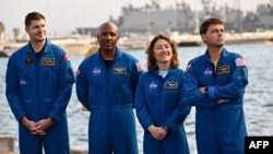 Canadian Space Agency astronaut Jeremy Hansen and NASA astronauts Victor Glover, Christina Koch and Reid Wiseman attend a press conference about the Orion crew module test capsule outside the USS San Diego at Naval Base San Diego in San Diego, California, on Feb. 28, 2024.