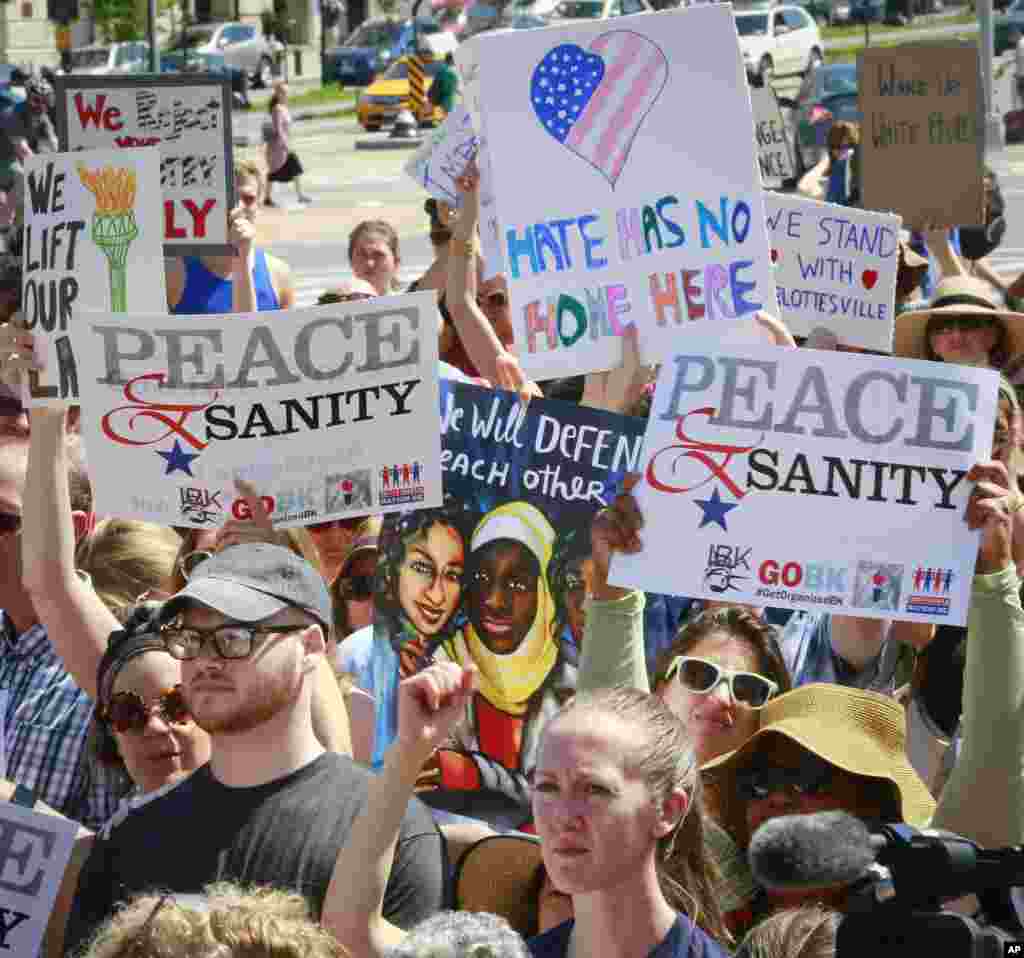 Protesters listen during a "Peace and Sanity" rally in the Brooklyn borough of New York, Aug. 13, 2017, about white supremacy violence in Charlottesville, Virginia.