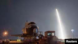 The SpaceX Falcon 9 test rocket lifts off from Space Launch Complex 40 at the Cape Canaveral Air Force Station.