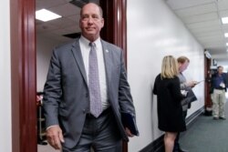 FILE - In this March 28, 2017, file photo, Rep. Ted Yoho, R-Fla., leaves a closed-door strategy session at the Capitol in Washington.