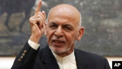 FILE - Afghan President Ashraf Ghani speaks during a press conference at the presidential palace in Kabul, Afghanistan, July 15, 2018. 