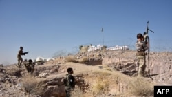 FILE - Security forces take part in an operation against Taliban militants in Arghandad district of Kandahar province, Afghanistan, Nov. 2, 2020. 