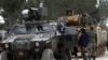 FILE - Turkish forces and members of the Free Syrian Army are seen on the outskirts of al-Bab, Feb. 4, 2017.