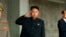 FILE - North Korean leader Kim Jong Un (C) salutes during a Sept. 9, 2013, military parade in Pyongyang.