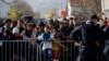 FILE - Migrants wait to register with police at a refugee center in the southern Serbian town of Presevo, Nov. 16, 2015. Newly elected Canadian Prime Minister Justin Trudeau will announce Tuesday his plan to resettle 25,000 Syrian refugees.