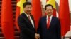 FILE - Chinese President Xi Jinping, left, poses for a photo with Vietnam's Prime Minister Nguyen Tan Dung before their meeting in Hanoi, Nov. 5, 2015. 