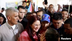 Cilia Flores (red shirt), wife of Venezuela's President Nicolas Maduro, greets supporters as she arrives for a simulation of the government's official July 30 vote for a new assembly, in Caracas, Venezuela July 16, 2017. 