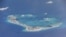 FILE - Chinese dredging vessels are purportedly seen in the waters around Mischief Reef in the disputed Spratly Islands in the South China Sea.